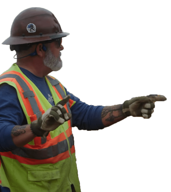 construction worker pointing at worksite