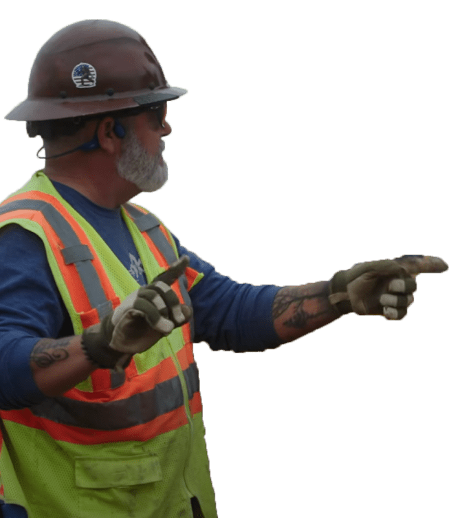 construction worker pointing at worksite
