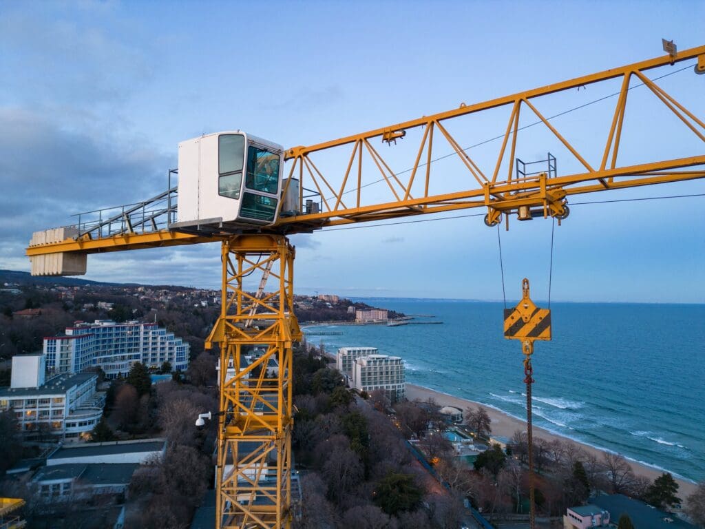 busy construction site and construction equipment tower crane